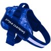 A happy dog wearing a comfortable dog harness for outdoor walks, offering a snug fit and support